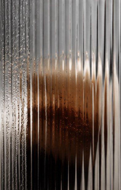 Coffee seen through fluted glass